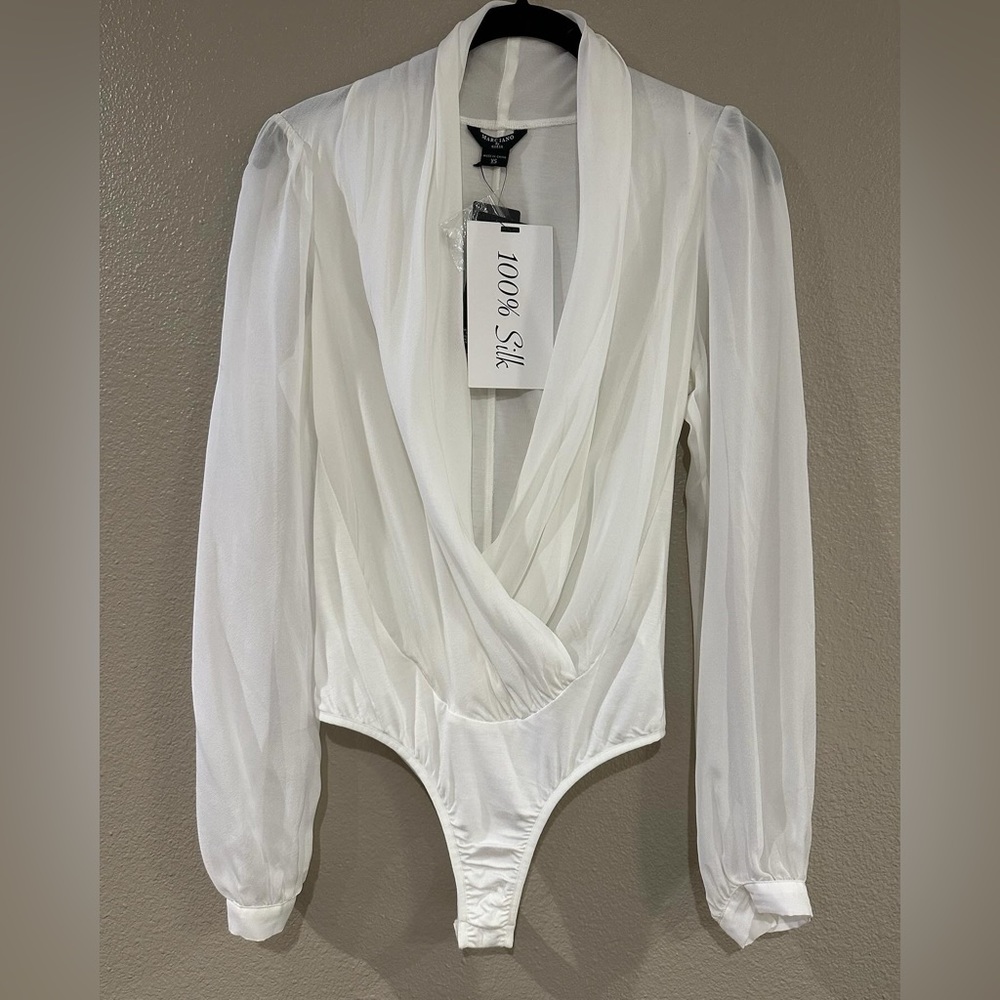NWT Guess bodysuit.